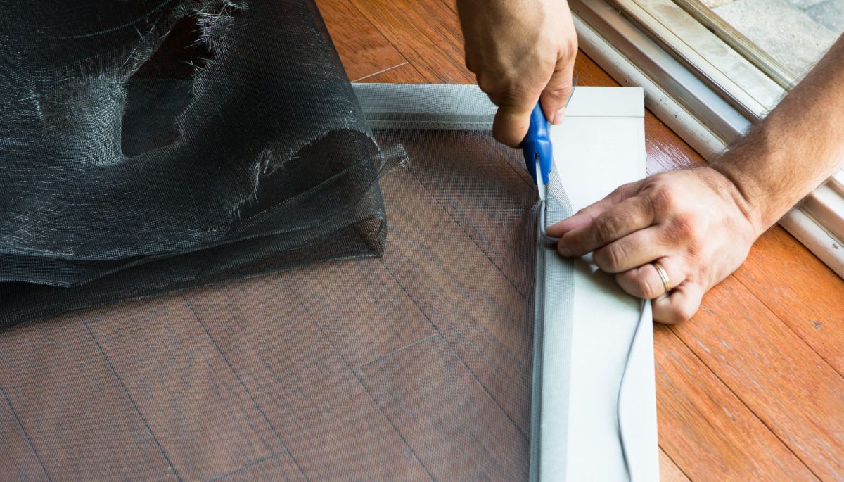 person-fixing-a-screen