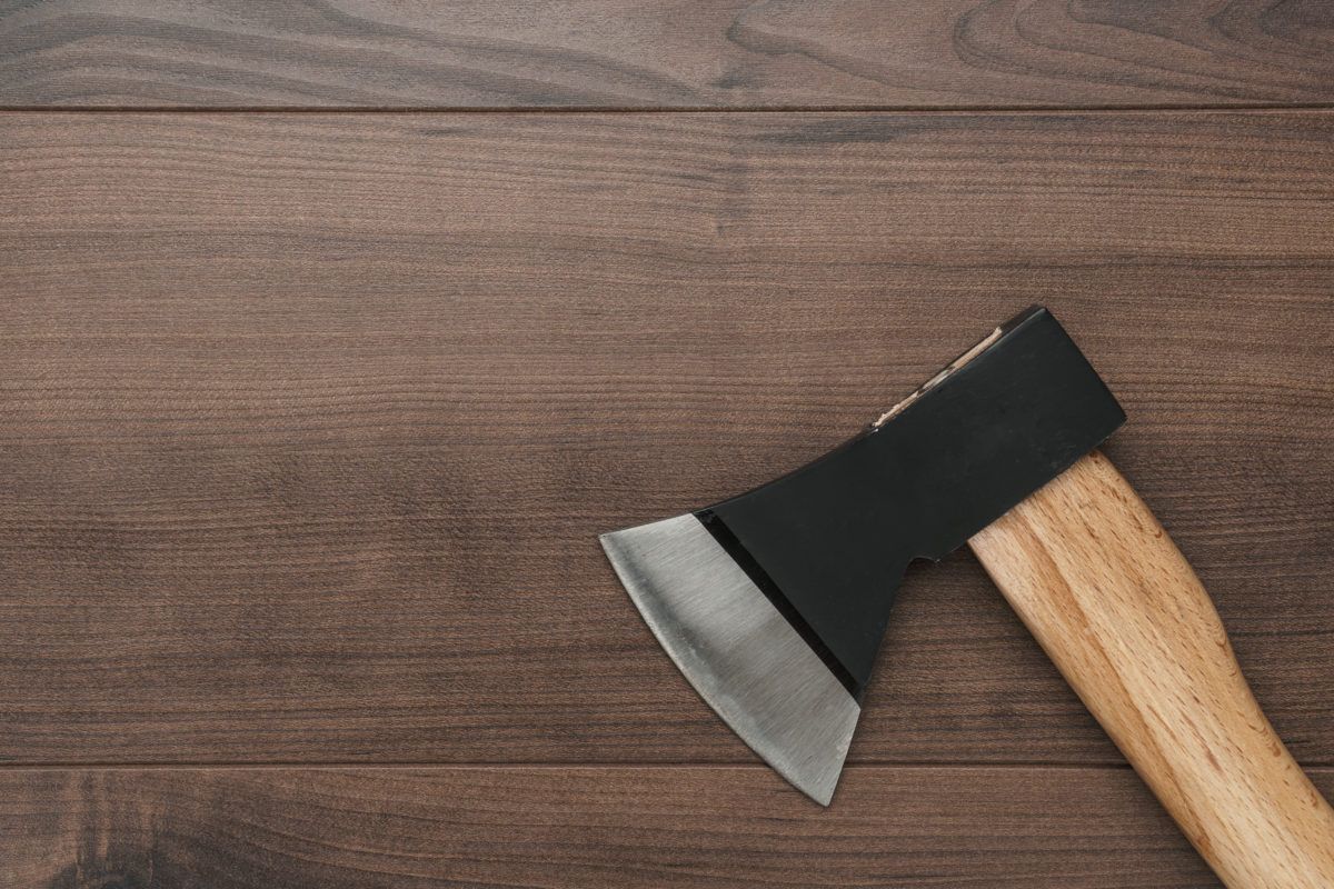 axe-on-wooden-background