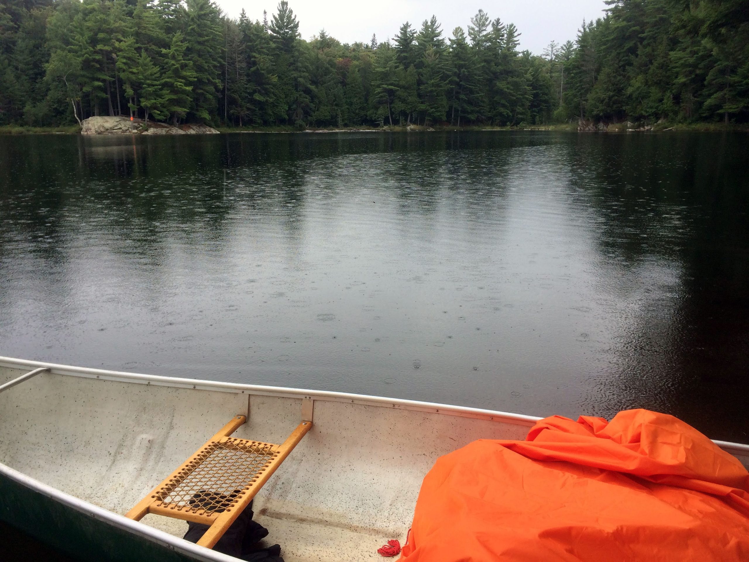 a tarp in a canoe on Rain Lake.