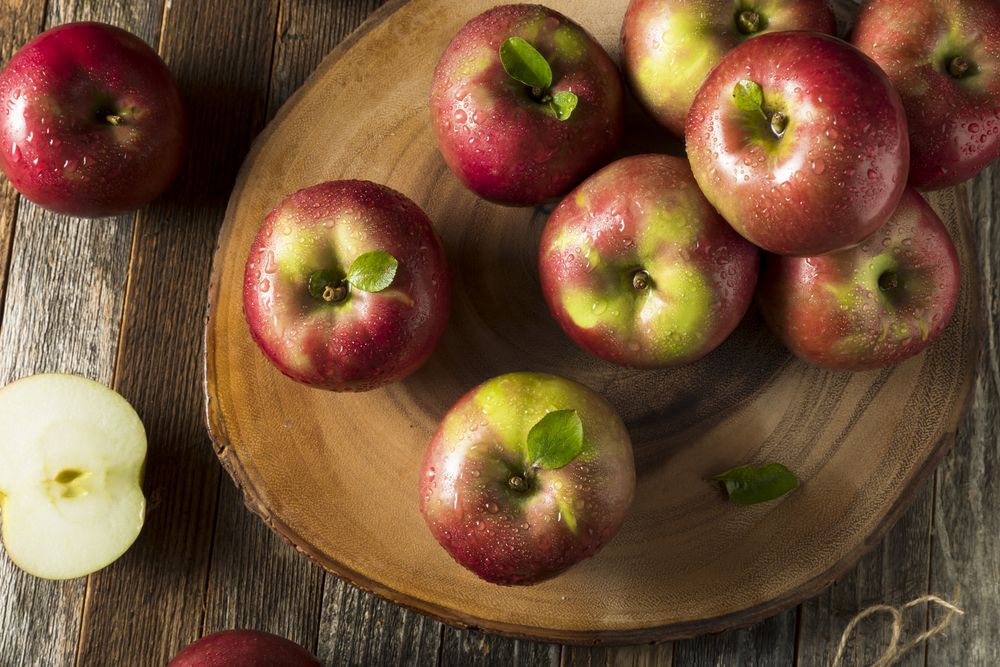 Apples on a wooden cutting board