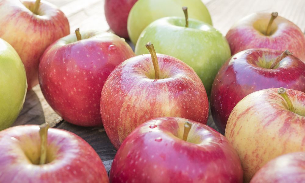 Red/green gala apples on a table