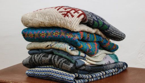 A pile of old wool sweaters