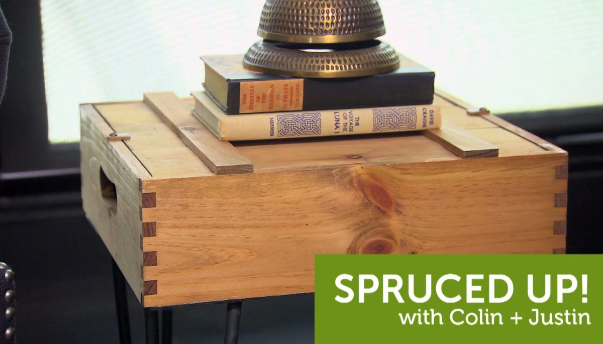 A DIY bedside table with books on top.