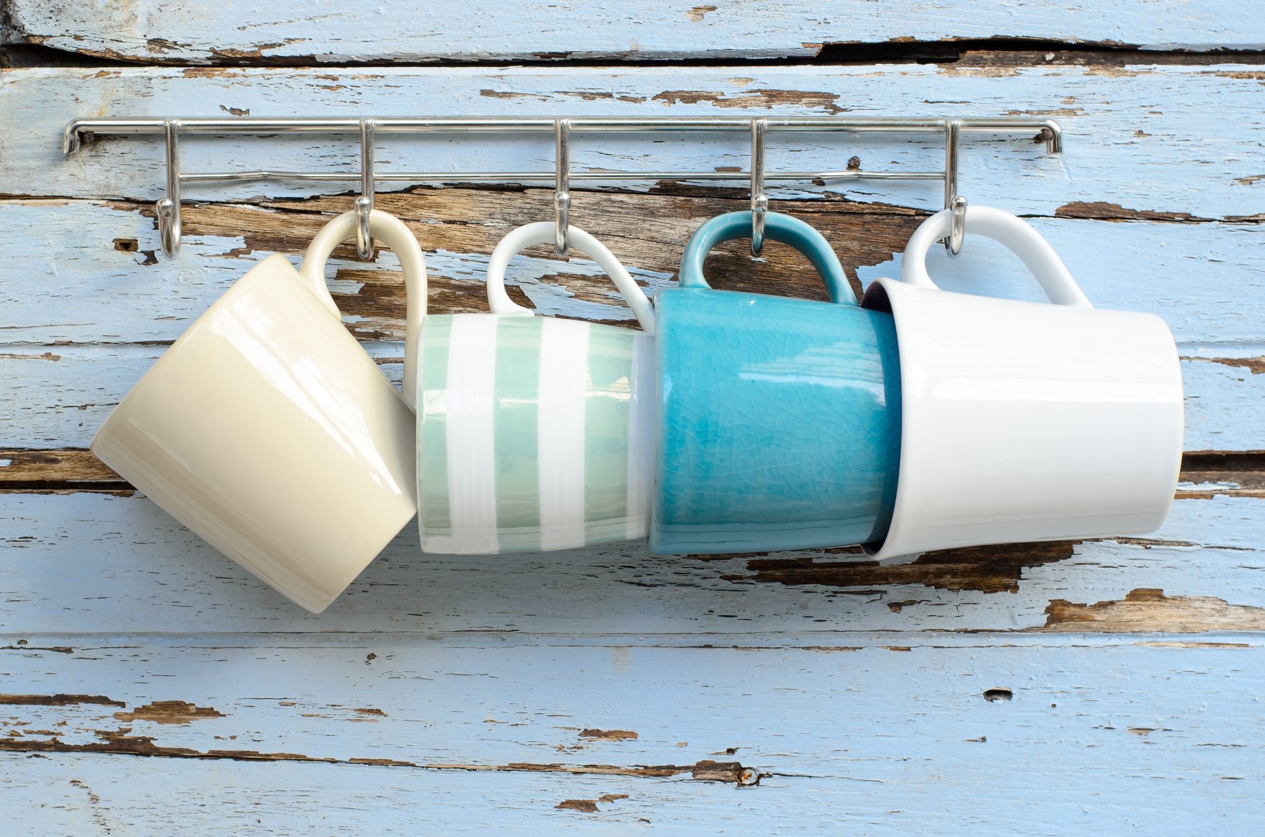 hooks-on-a-wooden-wall-with-cups-hanging