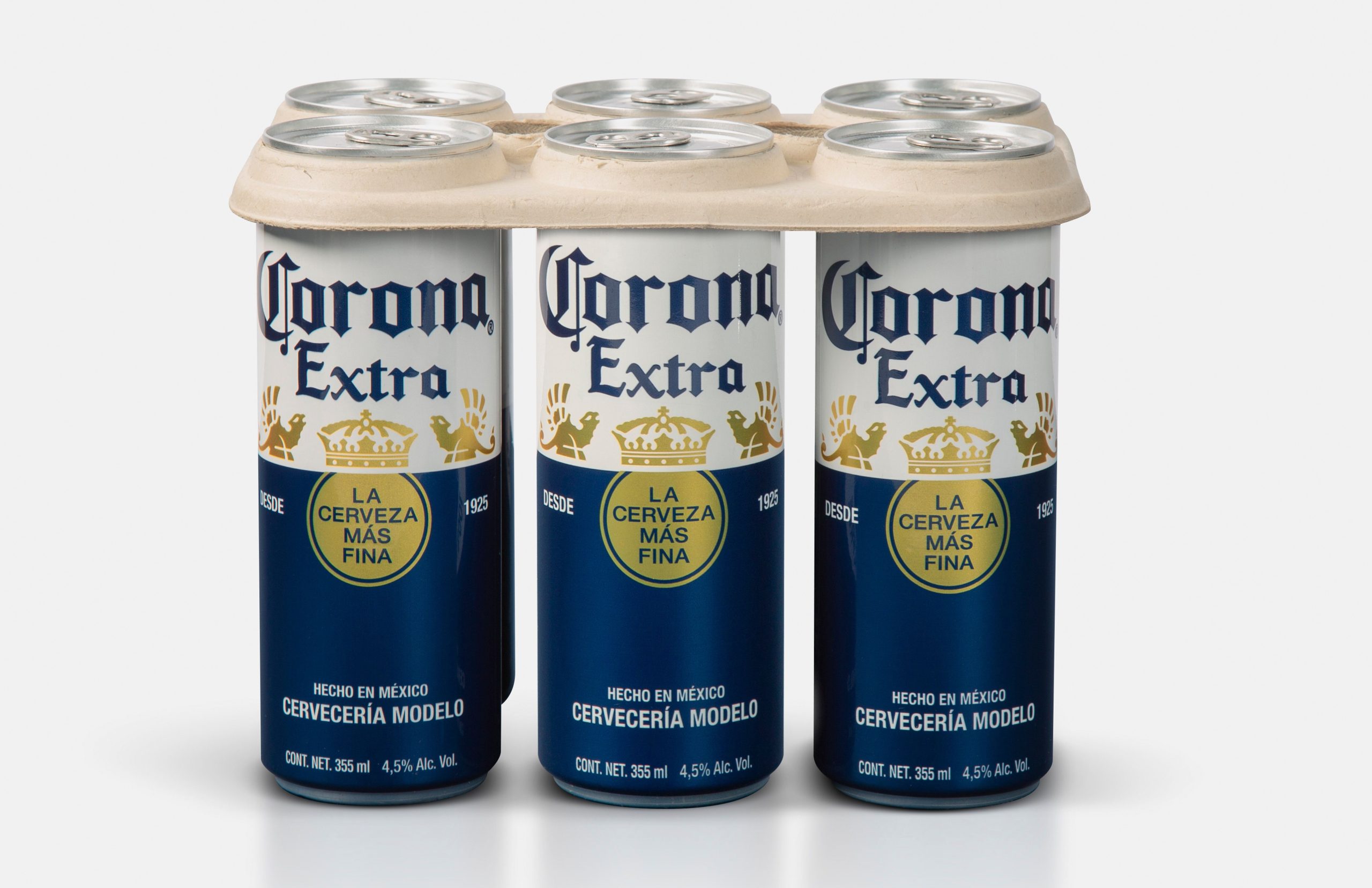A six-pack of Corona beer cans in a biodegradable holder