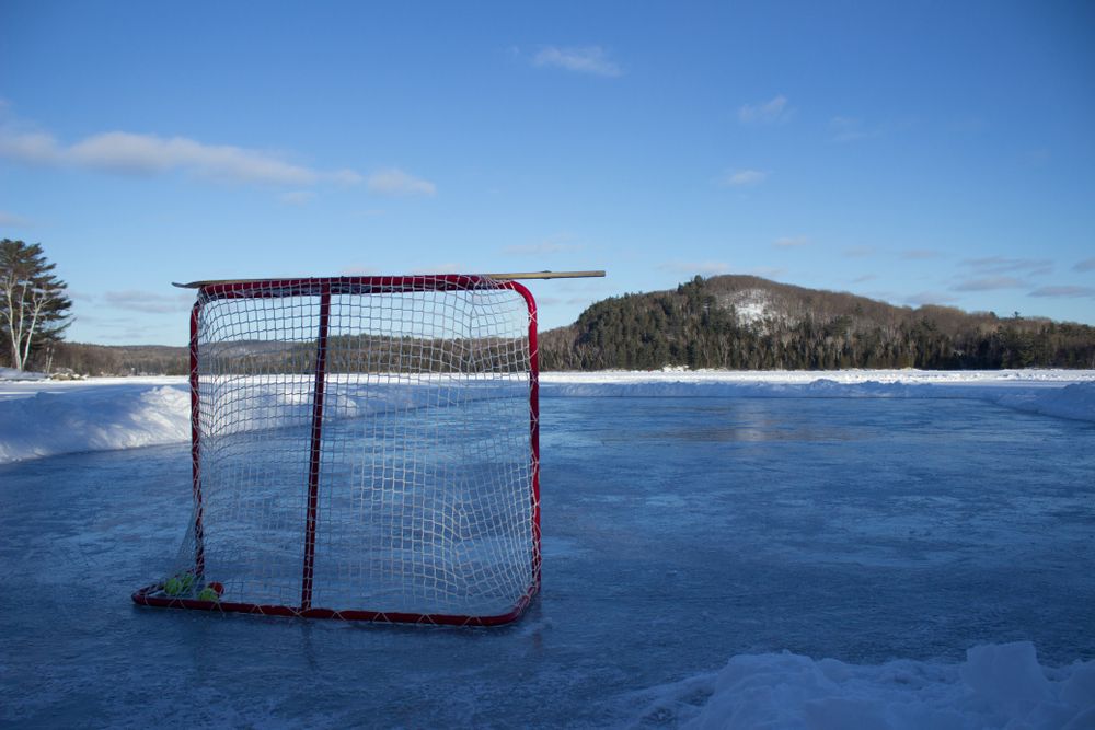 Lake hockey rink at sunset