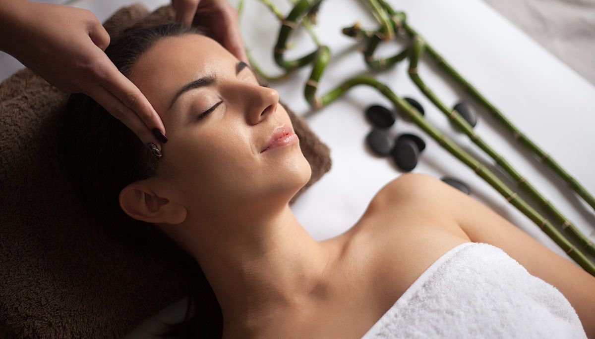 Close-up of a women getting a face massage at a spa.