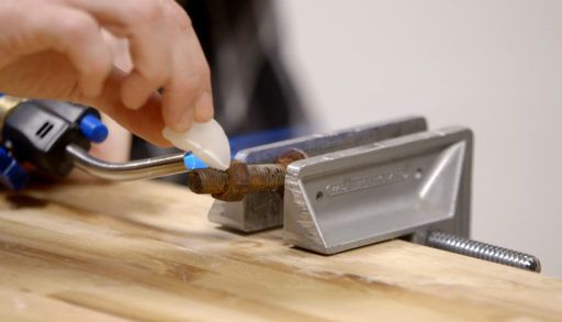 Wax used to loosen bolt.