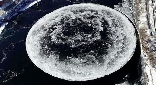 a huge spinning ice disc in the freezing waters of the Presumpscot River in Westbrook, Maine.
