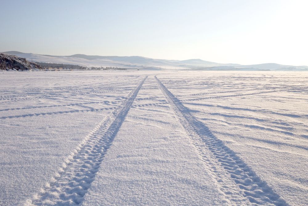 tire-tracks-on-ice-on-lake