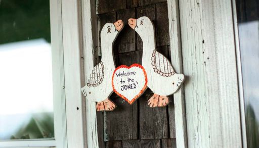 "Welcome to the Jones'" sign on a cottage door