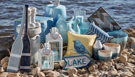 A collection of patio decor by a waterfront.