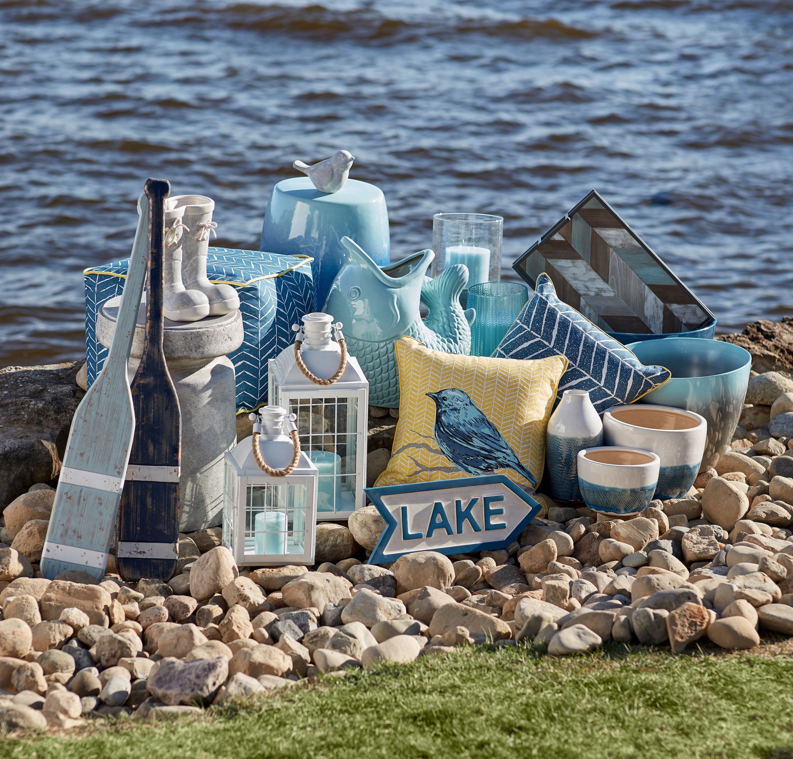 A collection of patio decor by a waterfront.