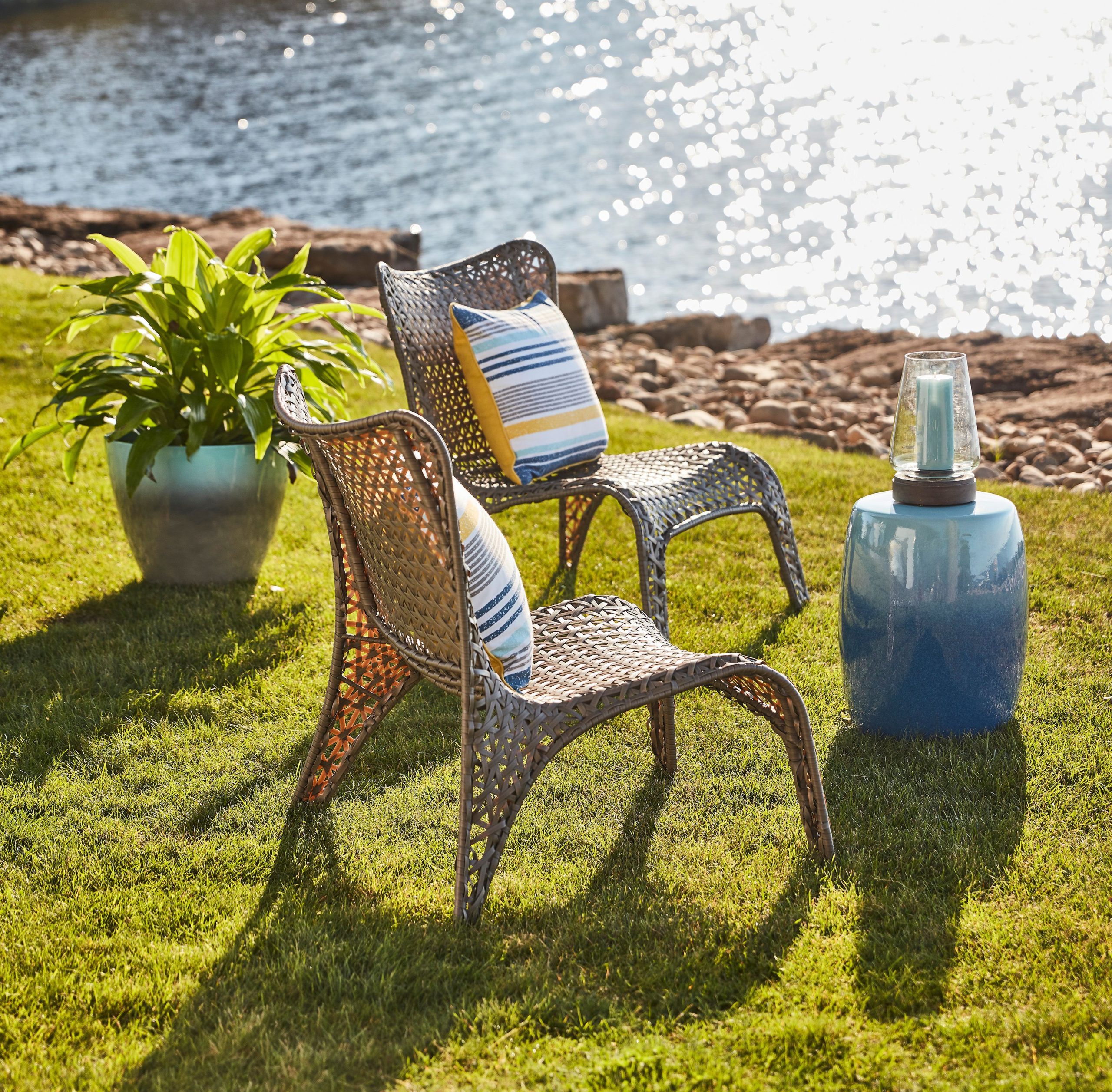 Lawn chairs along a waterfront.