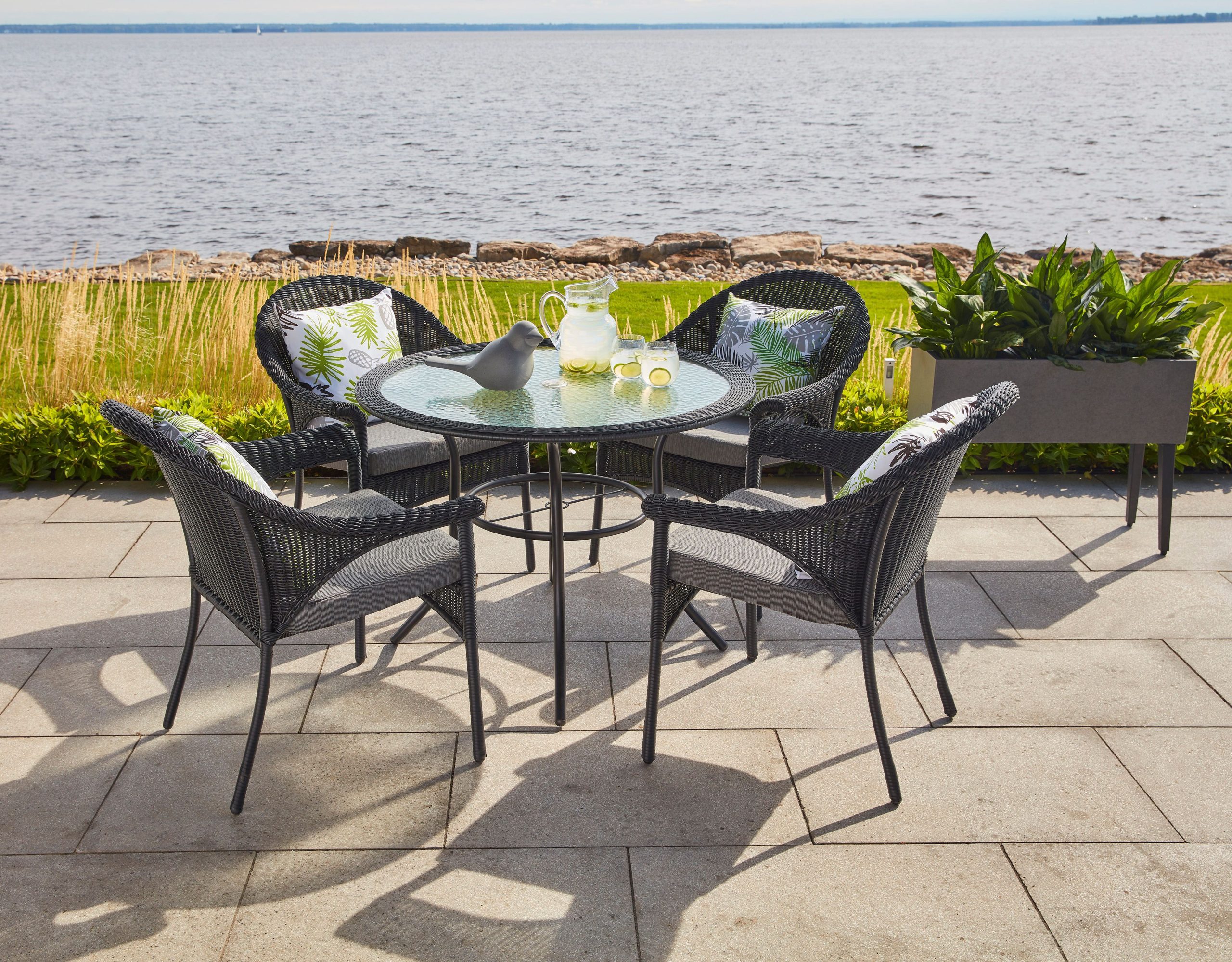 A patio set by a waterfront.