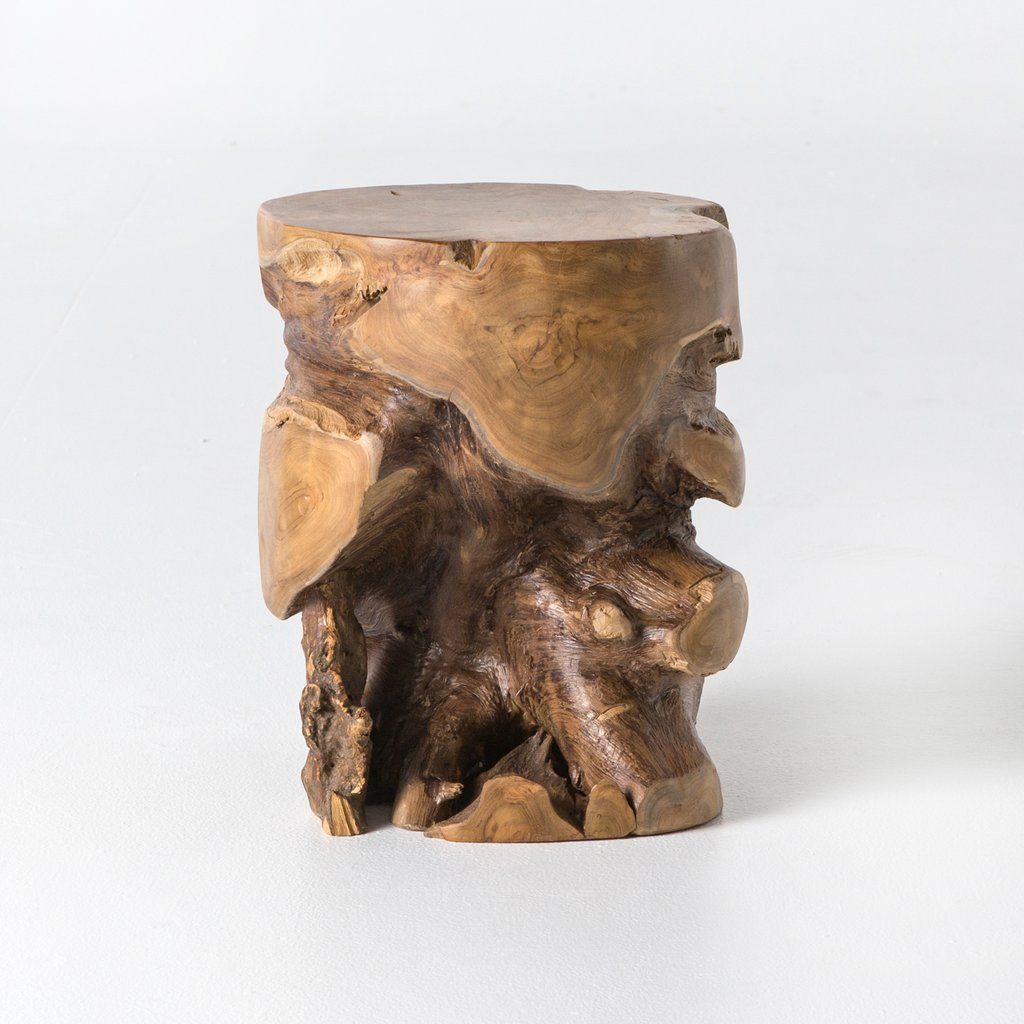 A stool that looks like a wood stump.