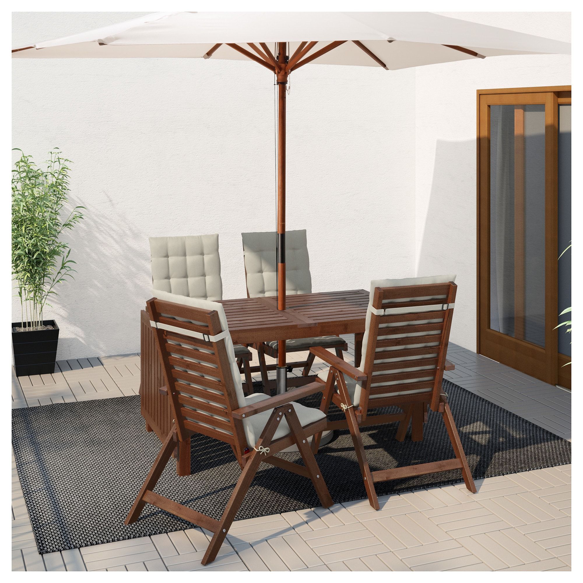 A brown patio set on a porch with an umbrella.