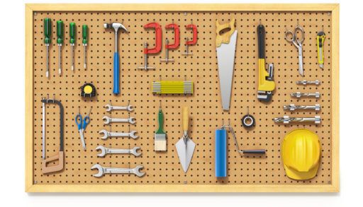 workshop pegboard with tools on it