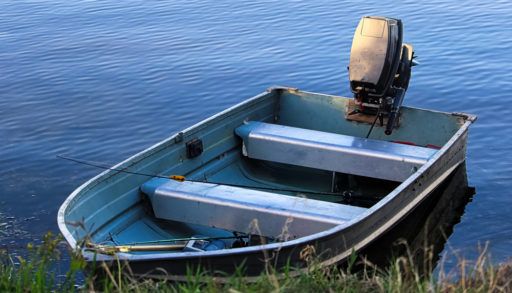 An aluminium fishing boat at the shore