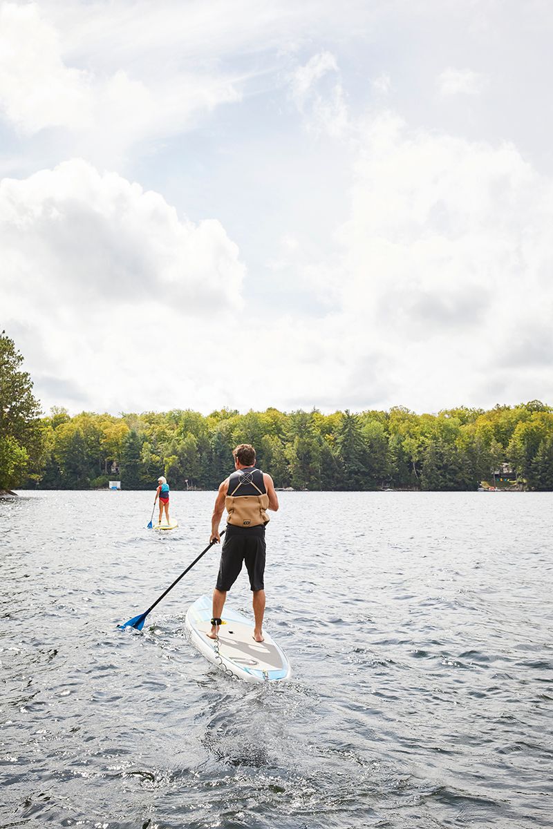 couple-wakeboarding-on-a-lake