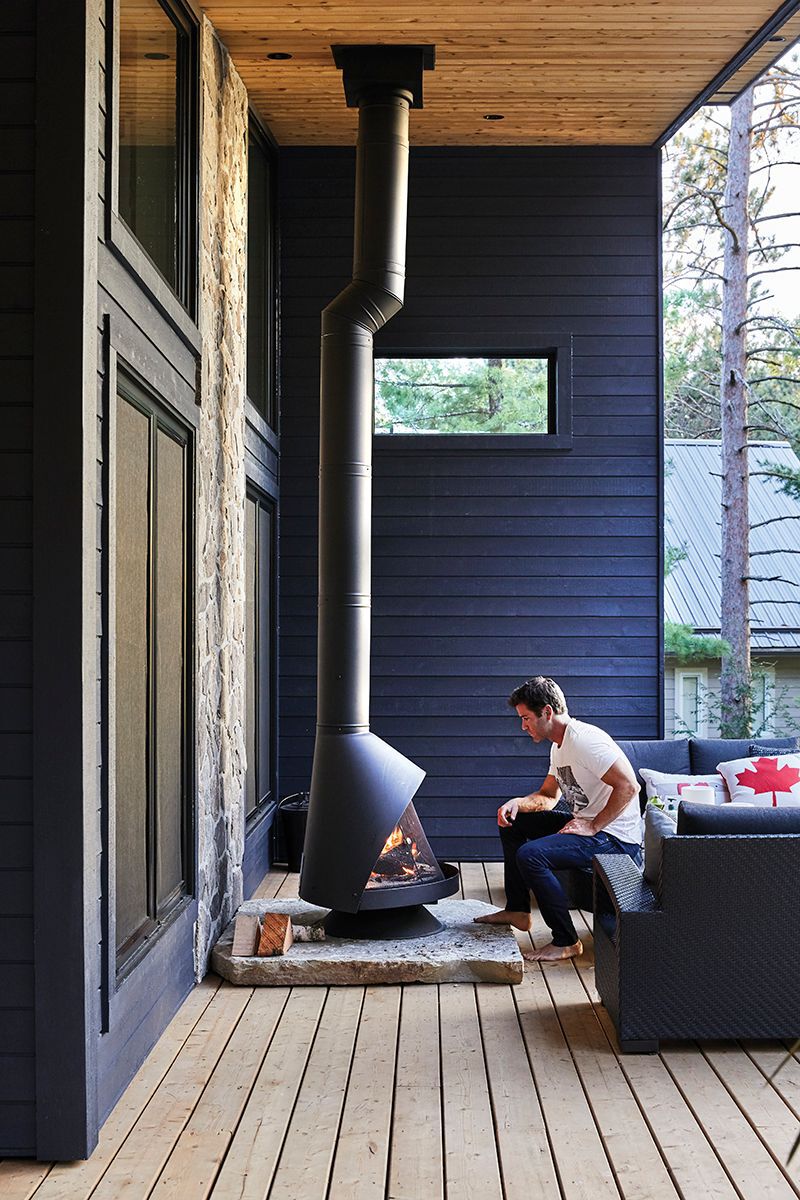 man-in-front-of-a-modern-fireplace