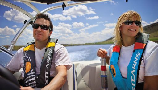 two-people-in-a-boat-with-life-jackets-on