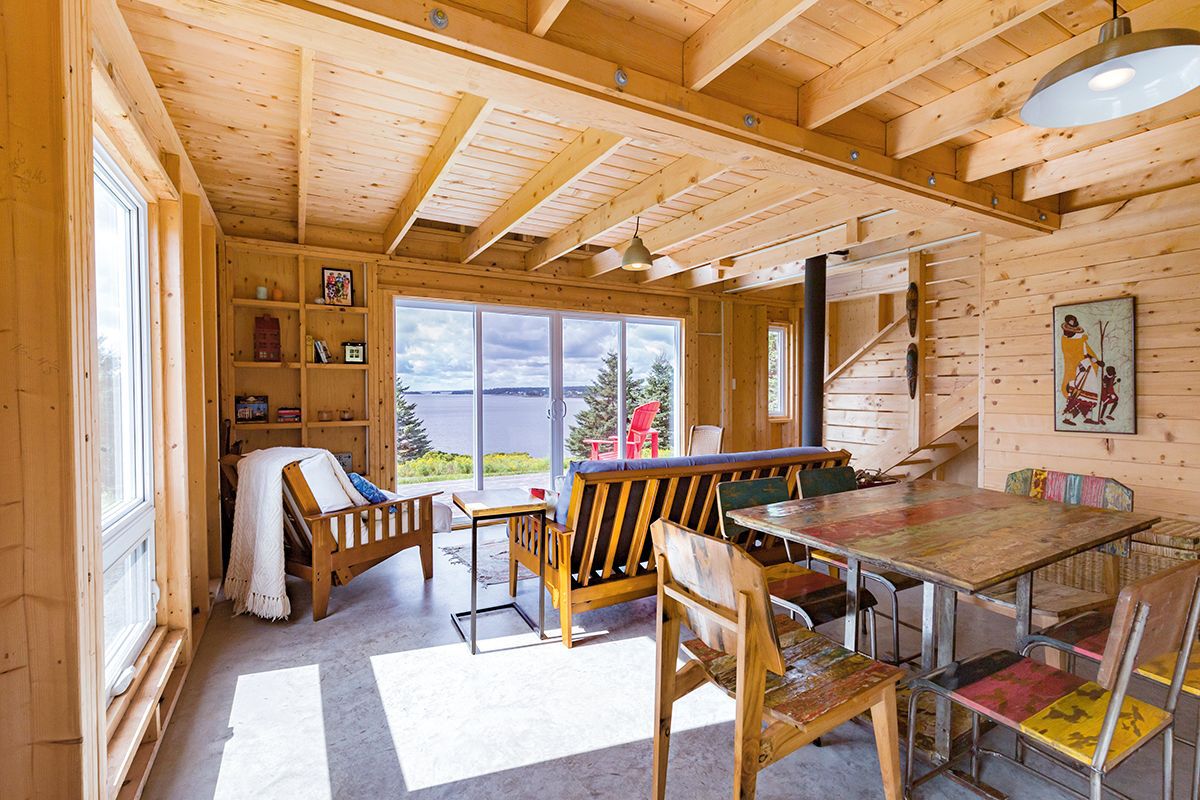 Interior view of table, couches, and sliding glass doors