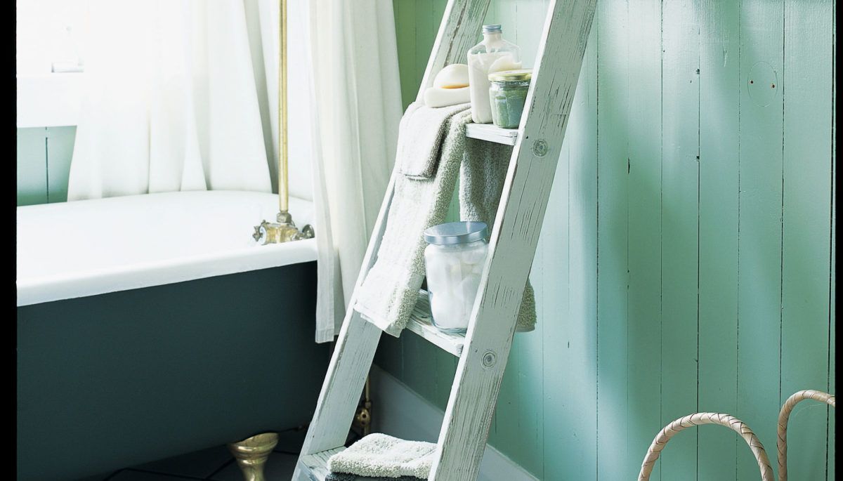 Ladder being used as shelves in bathroom