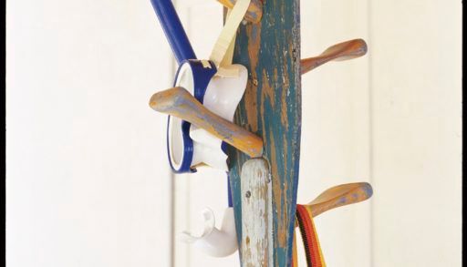 Rack made from paddles holding swimming accessories