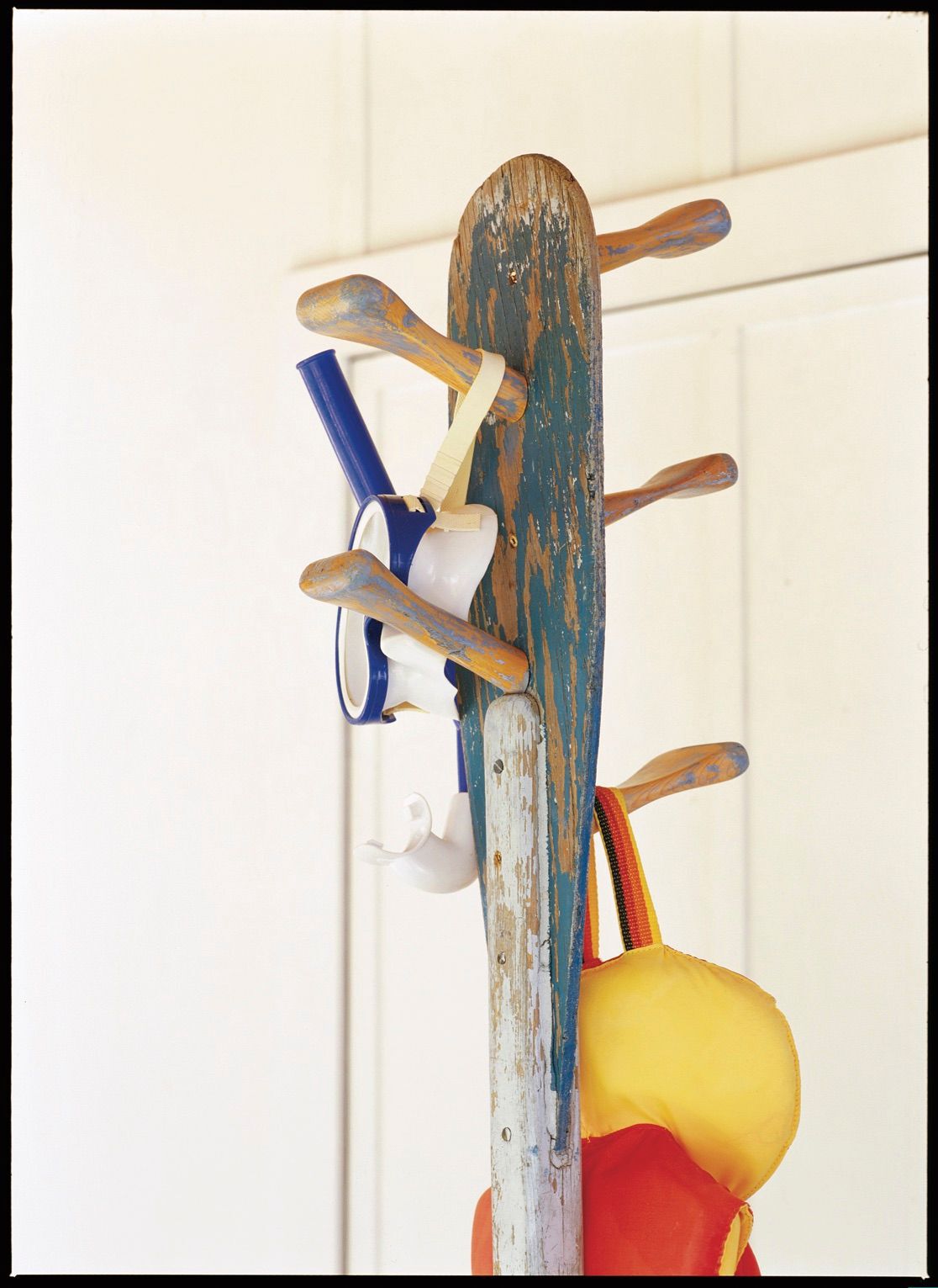 Rack made from paddles holding swimming accessories