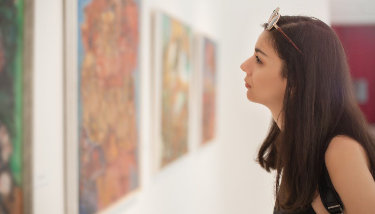 Woman looking at art in a gallery