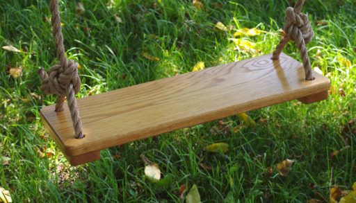 Seat of two-rope swing made from wood