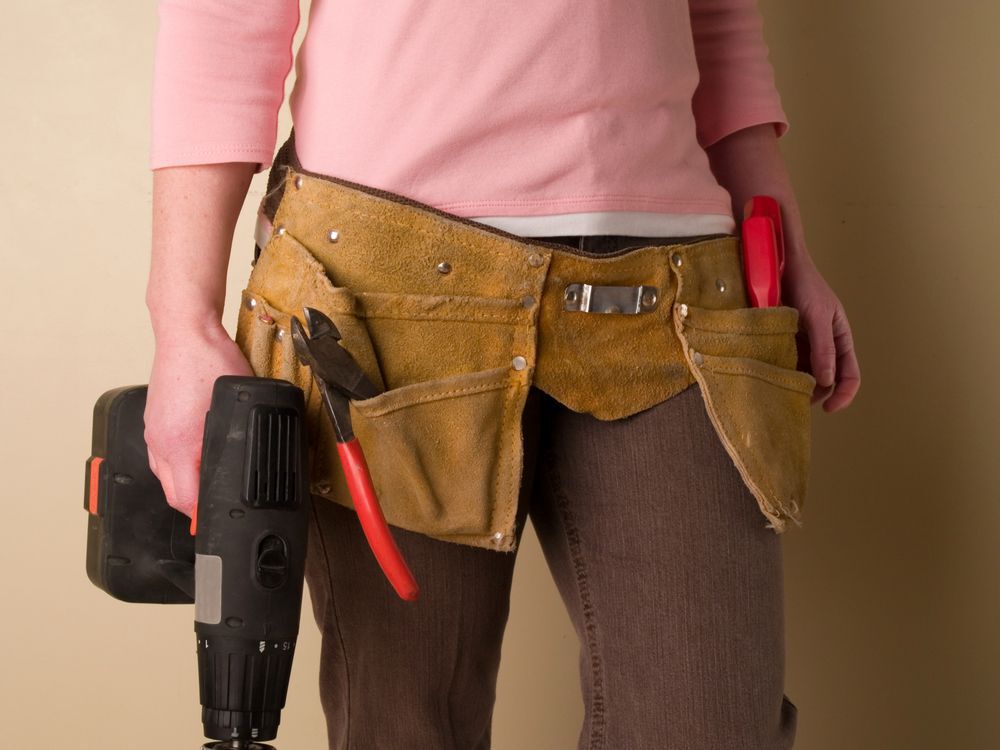 woman wearing toolbelt