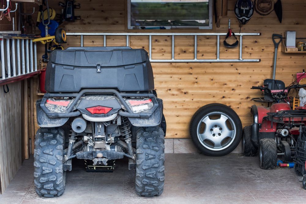 ATV quadbike parked at the garage after ride