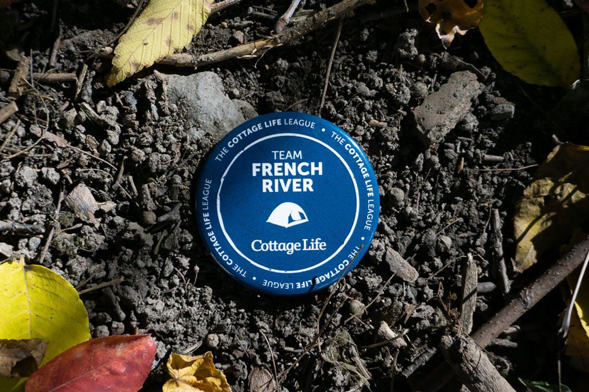 a button with French River on it