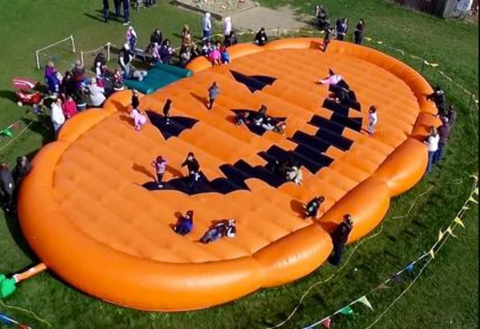 Merry Farms with kids jumping on pumpkin pad