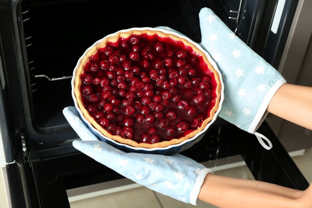 a-cherry-pie-coming-out-of-the-oven