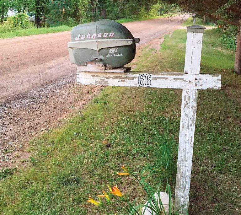 Johnson outboard motor turned into a mailbox on the side of the road