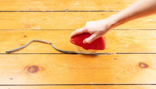 How to Fill Gaps in Floorboards and Seal Floorboards to Prevent Draughts and Heat Loss. best way to draught-proof stripped wooden floors. Using the Applicator