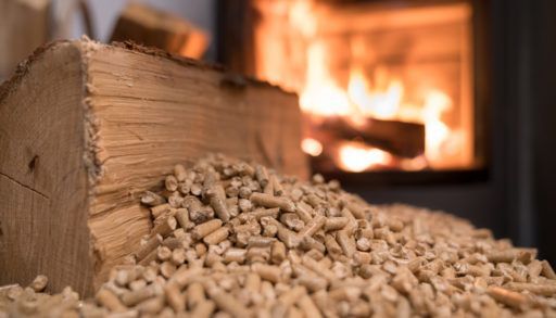 Wood stove heating with in foreground wood pellets