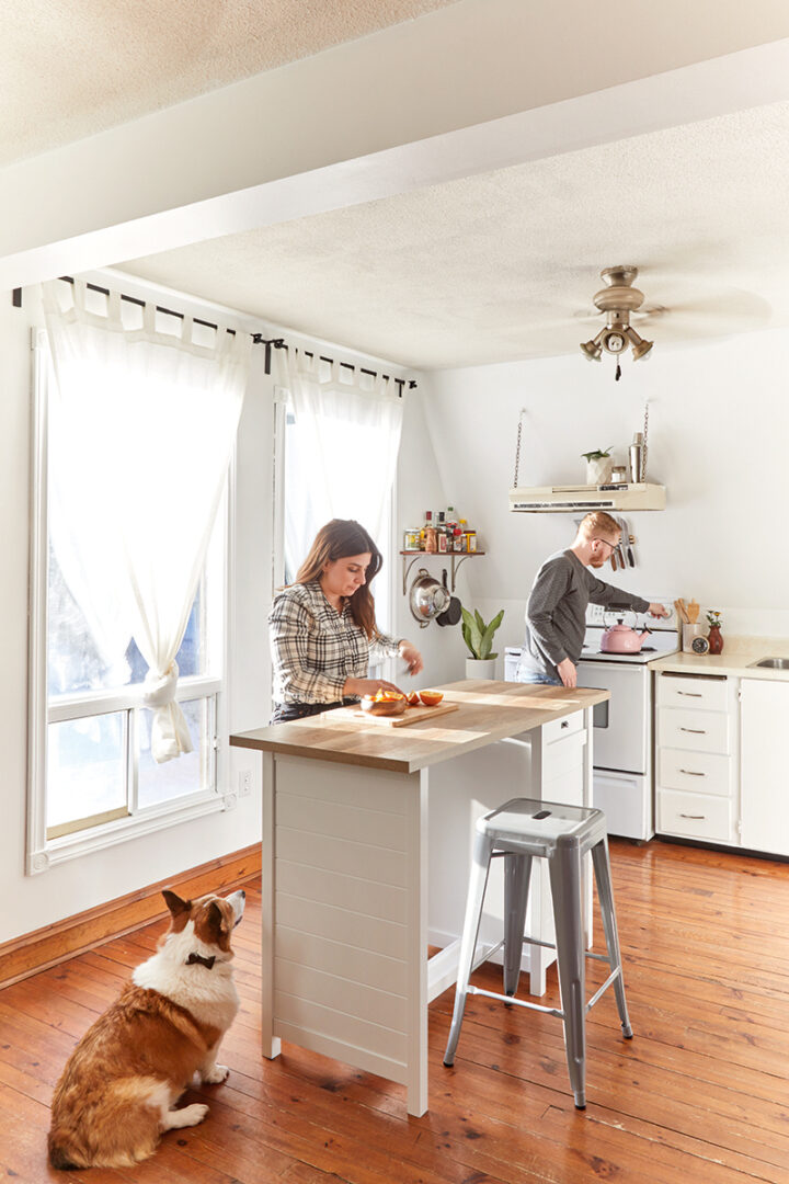 Julia and Adam cooking in the A-frame kitchen