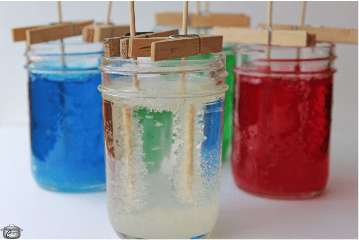 DIY rock candy project for kids forming in mason jars
