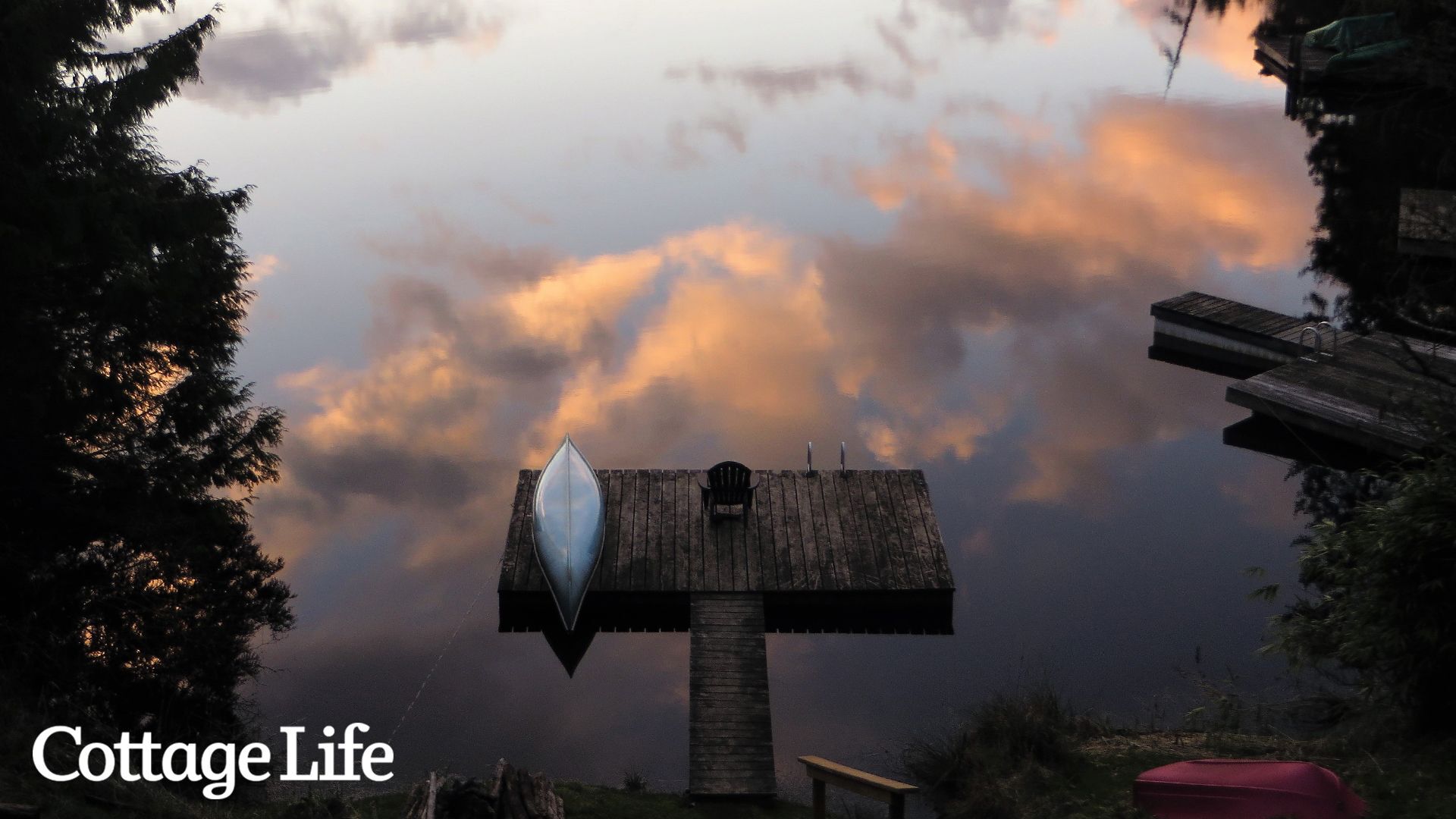Canoe sits on dock by the lake