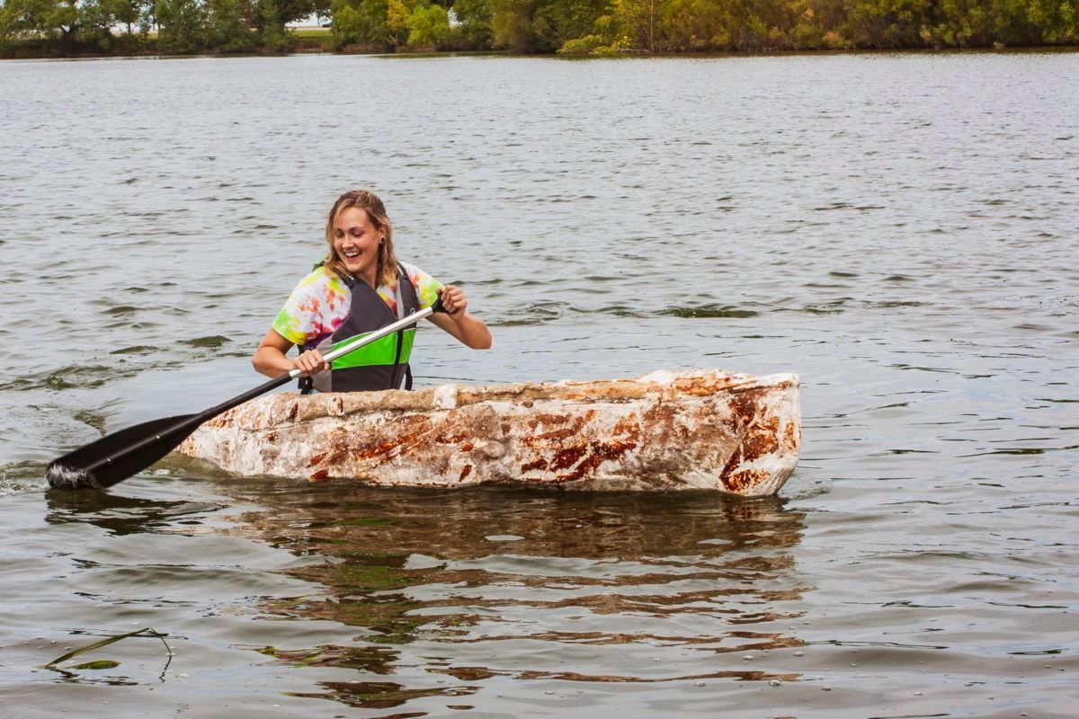 Girl in canoe made of fungi