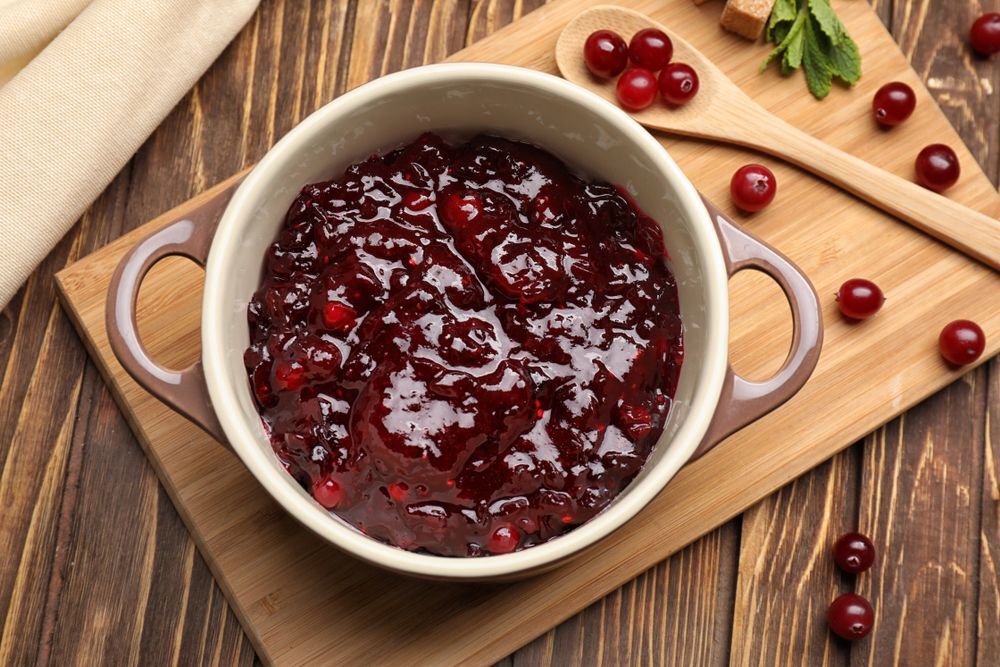 Cranberry sauce on wooden cutting board