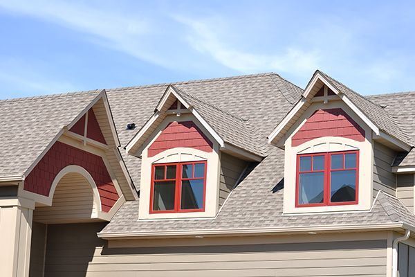 Gable dormers and roof of a residential home.