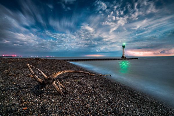 green light on the shore of Lake Erie from afar