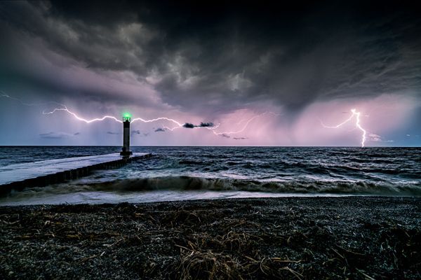port bruce lighthouse in the middle of a thunderstorm