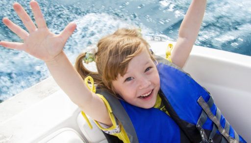 Girl in lifejacket on boat