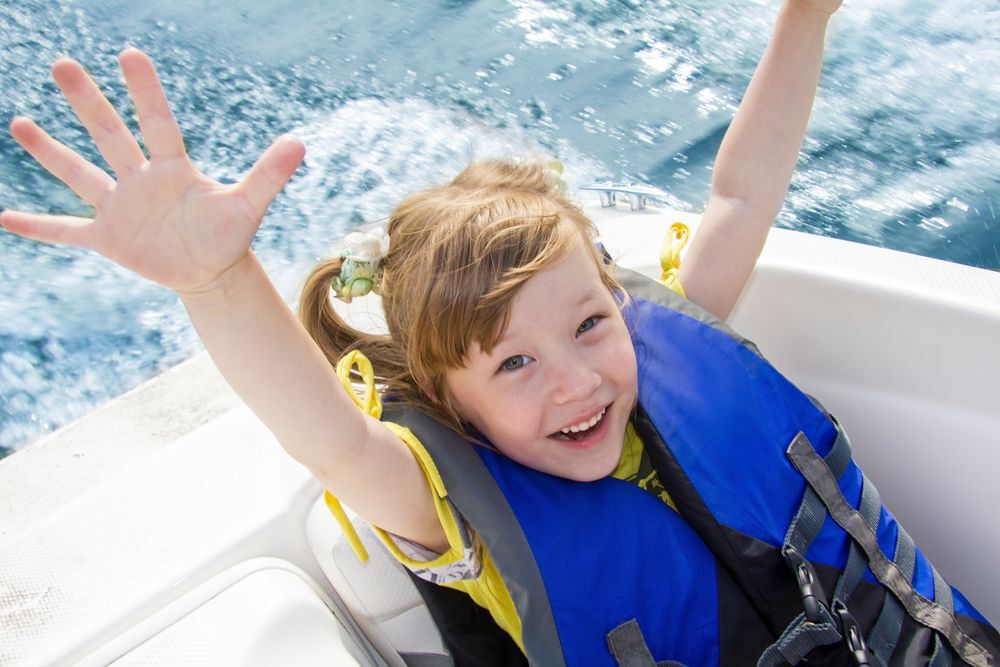 Girl in lifejacket on boat